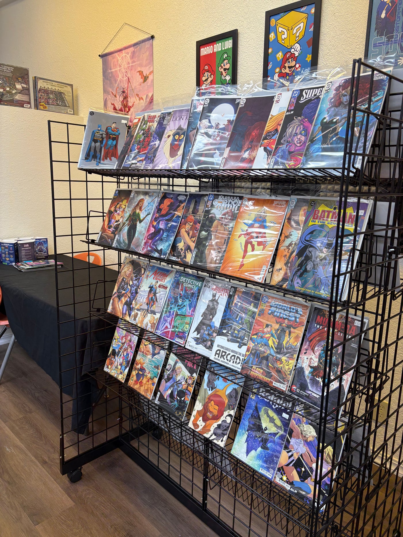 Comics and graphic novels displayed inside Glamorous Gamers