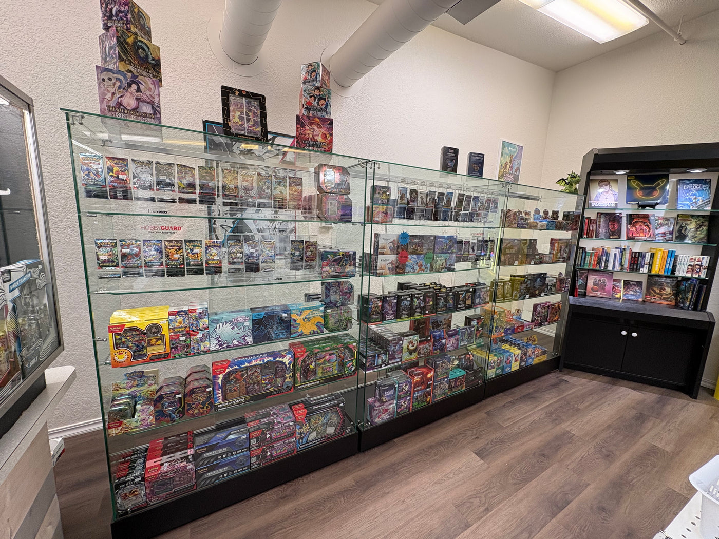 Trading cards and collectibles displayed inside Glamorous Gamers